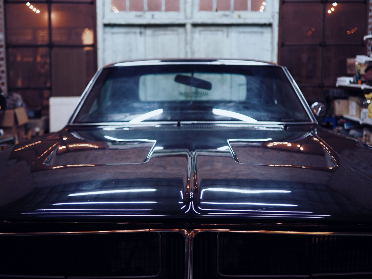 Dark colored muscle car in garage storage